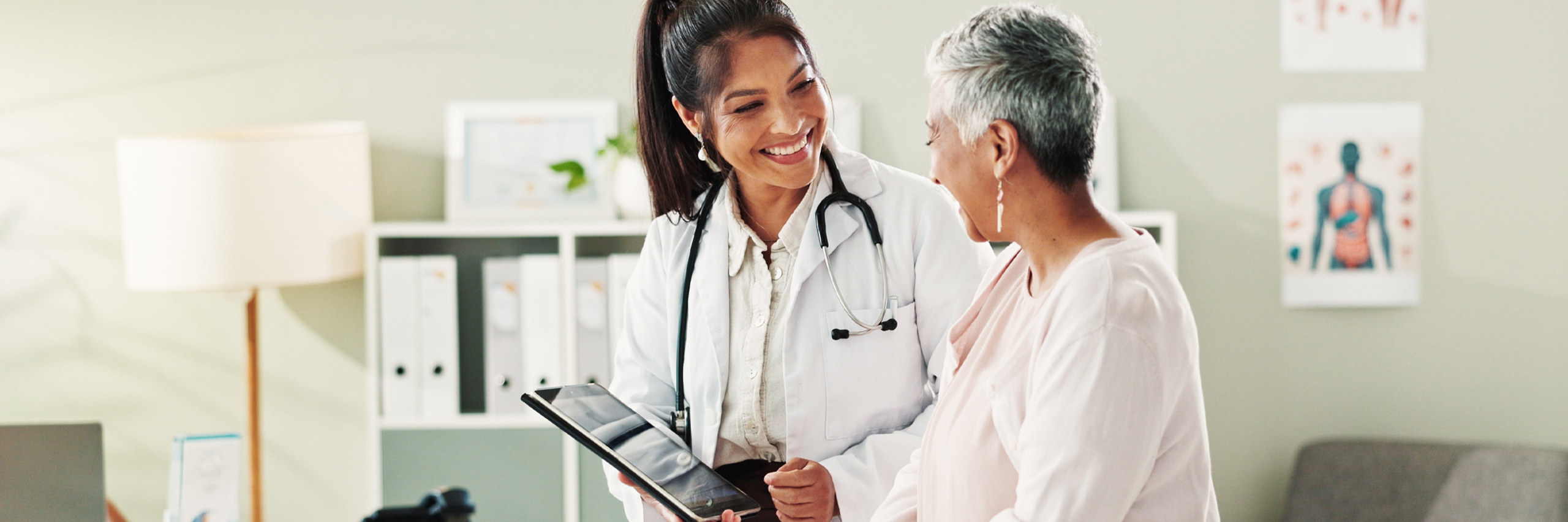 Mature Patient, Doctor and Tablet for Healthcare, Support or Conversation With Checkup Appointment in Office
